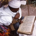 Priest reading Scripture